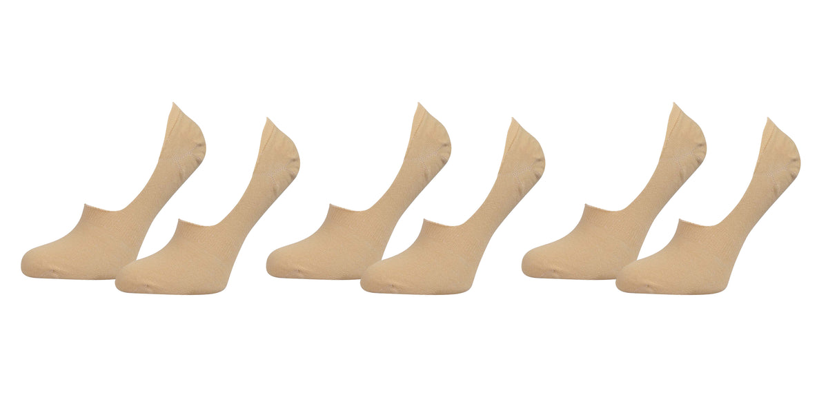 Set of six beige socks on a white background